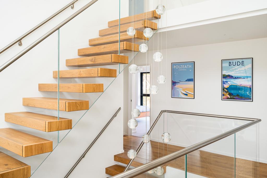 Wondering how to add value to your home? An oak floating staircase becomes a standout feature